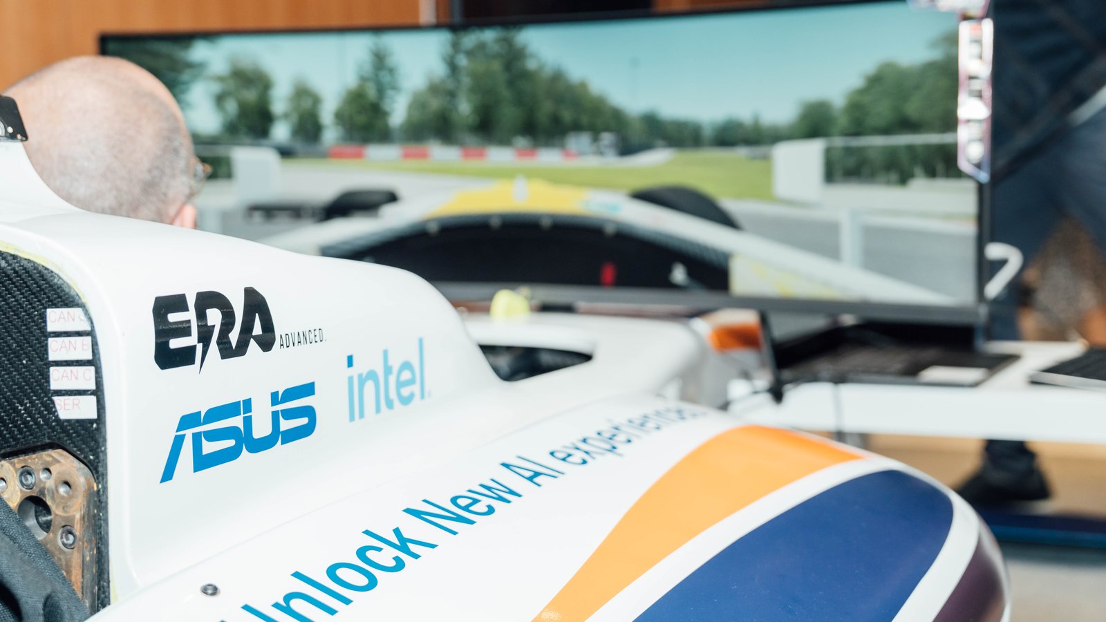 A full-size formula car simulator running an AI-assisted driver coaching experience, built with ERA Advanced.